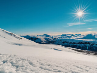 Obraz premium Bright winter morning with snowy mountains and blue skies under a shining sun.