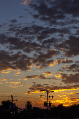 Silhouette of power line with beautiful sky at sunset background.