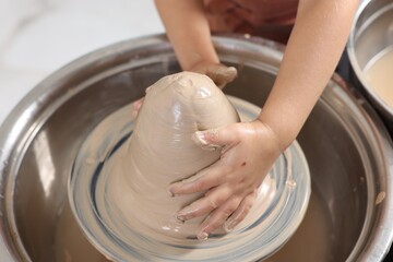 Hobby and craft. Girl making pottery indoors, closeup