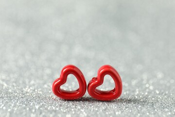 Red decorative hearts on shiny silver background, space for text. Happy Valentine's day