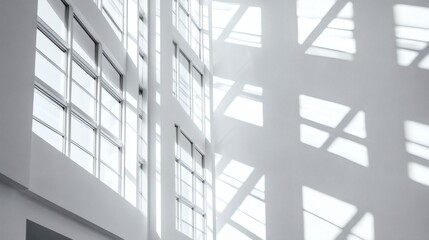 Naklejka premium Architectural Light and Shadow Play in Modern Building Interior