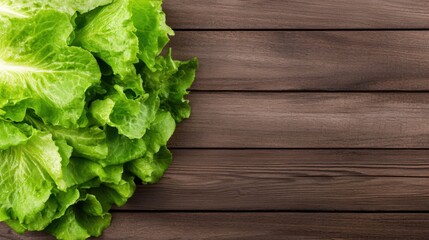 Fototapeta premium Fresh Green Lettuce Leaves on Rustic Wooden Table Background for Healthy Eating and Cooking Concepts