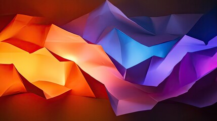 Obraz premium Abstract photograph of folded paper illuminated by dynamic orange, purple, and blue gradient light, creating a vibrant and artistic scene.