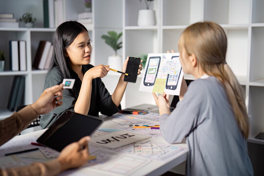 Engaging UX UI design discussion with mobile app prototypes and team feedback.