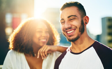 Fototapeta premium Laughing, love and bonding with couple in city for happy, travel vacation or spring break. Date, summer and romance with man and woman in New York for urban holiday, lens flare and funny together