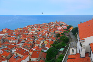 Aerial view of cityscape of the picturesque village with orange rooftops on Adriatic sea, Piran,...