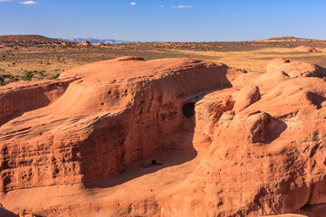 A rocky canyon with a large rock in the middle