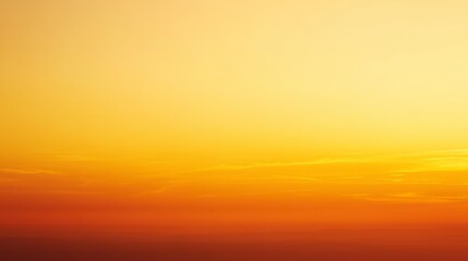 Obraz premium Warm Golden Sunset Over a Serene Horizon with Soft Cloud Patterns