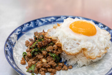 Stir-fried Thai holy basil with minced pork with rice and fried egg.