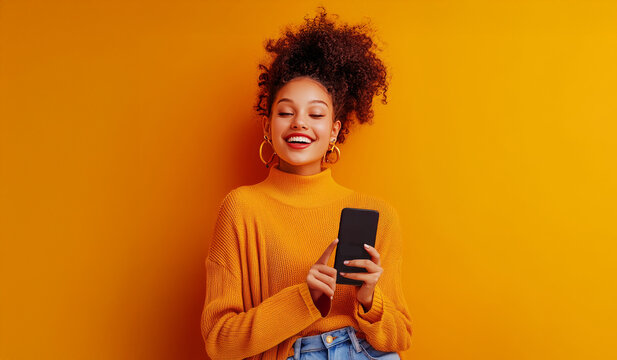 Joyful Discovery:  A young woman with an afro hairstyle beams with delight as she scrolls through her phone, the vibrant orange background mirroring her infectious energy. 