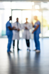 Blur, healthcare and teamwork with doctors in hospital for medical, support and solidarity. Nurse,...