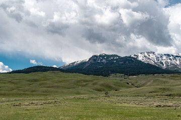 Fototapeta premium landscape in the mountains, bumpy terrain, hills, clouds