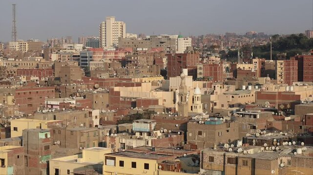 Cairo, Egypt A skyline view of downtown and Old Cairo from atop a minaret at the Ibn Tulun Mosque.
