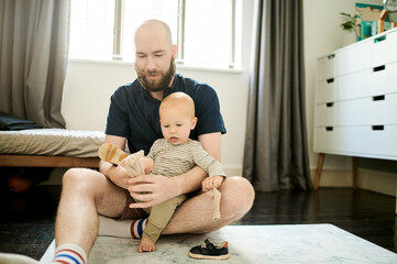 Help, shoes and father with baby in living room for ready, morning routine and clothes. Bonding,...