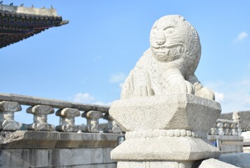 Old stone lion statue at a temple in South Korea