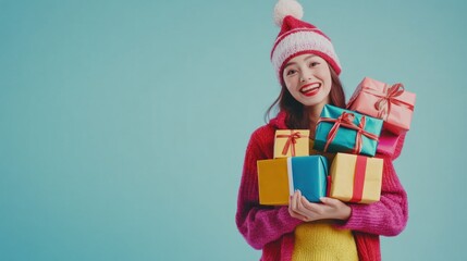 Obraz premium Happy woman carries Christmas gifts, studio shot