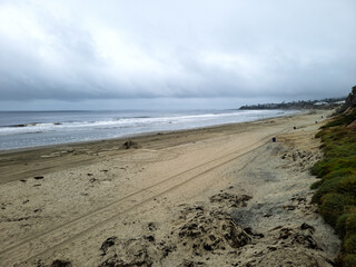 Bird eye view of North Pacific Beach in early summer morning with thick stormy clouds hanging over ocean coast, San Diego, CA