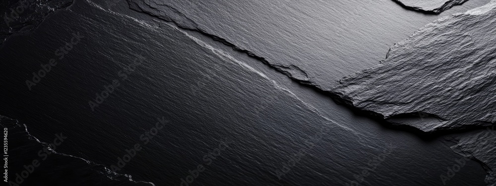 Poster smooth black slate surface with subtle texture and shadows, ideal for backgrounds or designs