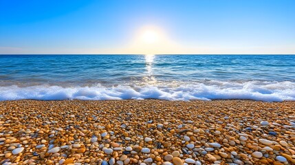 Serene Sunrise Over Calm Ocean Waves and Pebble Beach Landscape