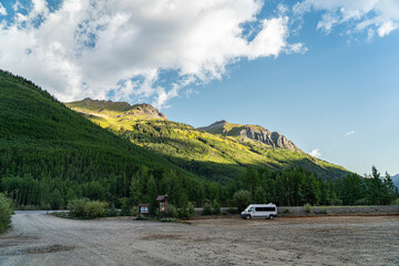 Scenic Landscape of a Mountain Valley with a campervan parked in the Foreground, San Juan Mountains, Colorado