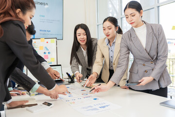Asian business group meeting to give advice on graphing and document work in the office