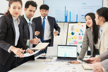 Asian business group meeting to give advice on graphing and document work in the office