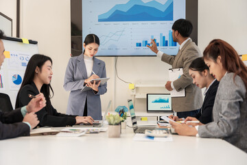 Asian business group meeting to give advice on graphing and document work in the office