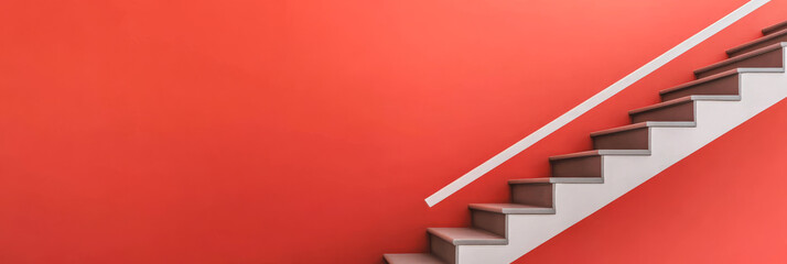 Modern staircase leading to upper level in home with vibrant red wall