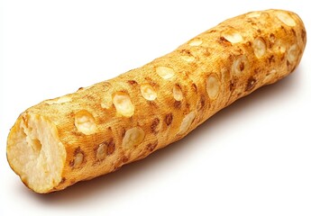 Close up view of a pale yellow root vegetable with a rough, textured surface and numerous small holes. The root is partially sliced, revealing a