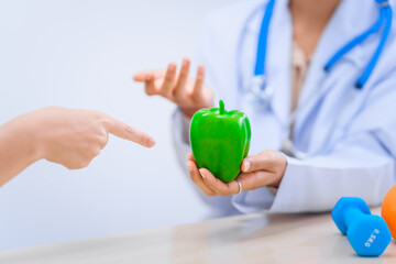 Female Asian nutritionist providing consultations for weight loss. reduce belly fat, offering...