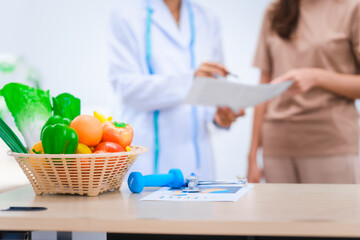 Female Asian nutritionist providing consultations for weight loss. reduce belly fat, offering...