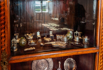 Decorative sideboard with silverware and figurines guest room in the Cesky Sternberk castle an hours drive from Prague