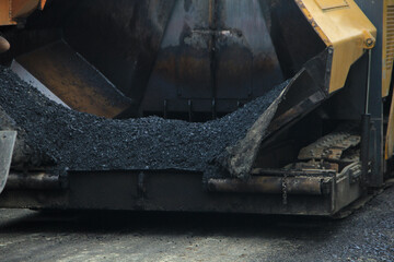 Road asphalting process, road paving using asphalt paver machine and steam roller compactor during construction and repair work, workers at construction site, hotmix asphalt