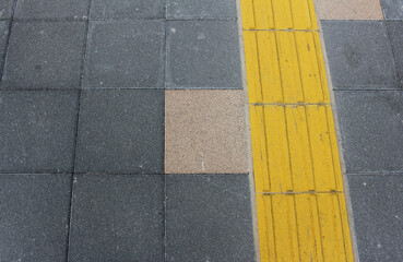 Yellow blocks of tactile paving for blind handicap. Tactile pavement for the visually impaired...