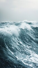 Fototapeta premium Turbulent Ocean Waves with Splashing Water Against Gray Sky