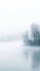 Serene Misty Landscape with Calm Water and Bare Trees at Dawn
