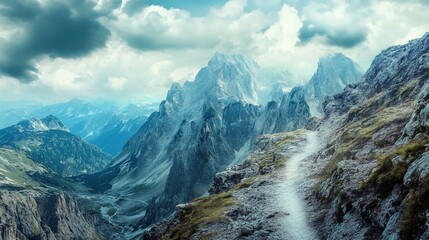 Mountain path leading to snowy peaks with cloudscape overhead in a breathtaking scene