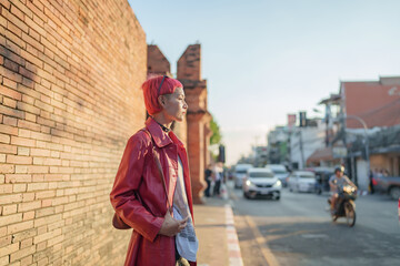 Gen z girl leather fashion with punk Asian woman tourist of local city Southeast Asia travel trendy...