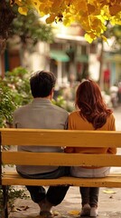 Naklejka premium Couple sitting park bench autumn city background romance date