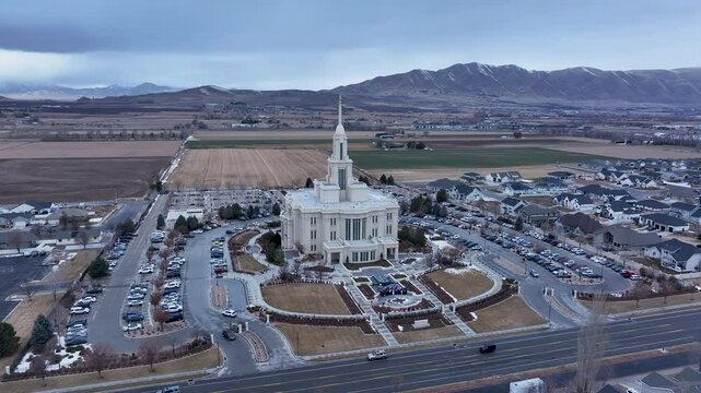 Aerial Payson Utah LDS Temple mountain valley circle 4. The Church of Jesus Christ of Latter-day Saints, LDS or Mormon religion. Sacred building for eternal worship. Residential neighborhood.