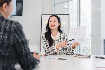 Businesswoman presenting financial report in modern office meeting with confidence and enthusiasm