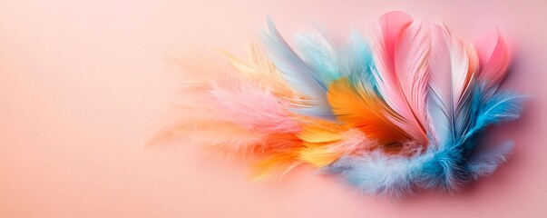 Obraz premium A delicate cluster of pastel feathers, soft hues, light and airy. Dreamy pastel palette.