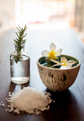 Flower, rosemary and water in spa with bath salts for skincare, wellness and natural treatment. Salon aesthetic, dermatology and herbs for cosmetics, aromatherapy and beauty for zen, calm and peace