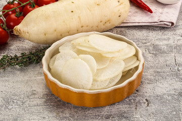 Sliced white daikon radish in the bowl