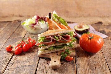 Healthy Club Sandwich on wood background