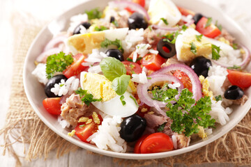 bowl of rice salad with egg, tuna and tomato