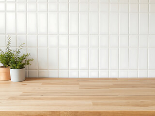 Close up of oak wood wooden kitchen counter on white ceramic wall tiles in background
