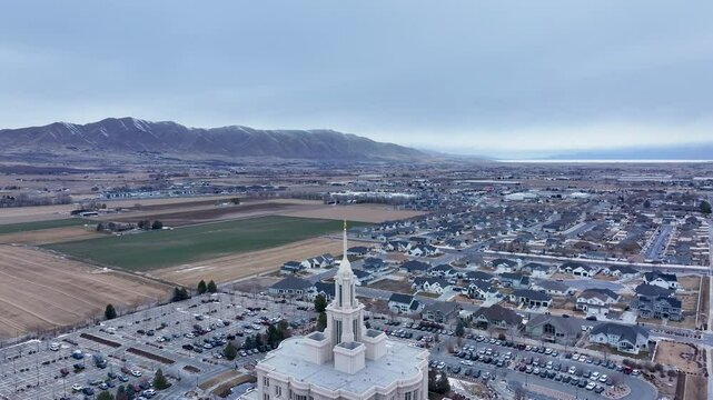 Aerial Payson Utah LDS Temple overhead pull. The Church of Jesus Christ of Latter-day Saints, LDS or Mormon religion. Sacred building for eternal worship. Residential neighborhood.