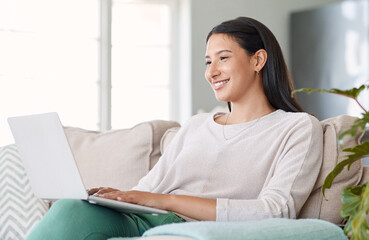 Sofa, happy woman and laptop with connection for search movie, entertainment and film for christmas...