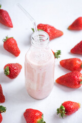 photo of strawberries and a bottle of milk shake